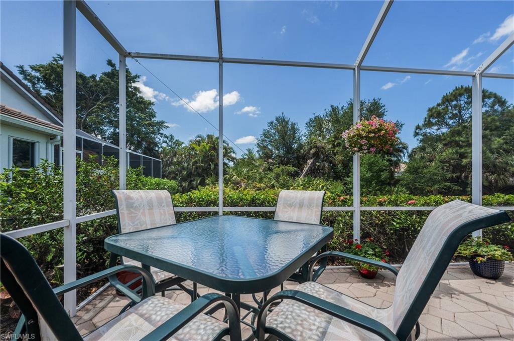 917 Fairhaven Court, Unit 29 Naples, FL 34104 - Photo 22 of 40 a view of a patio with a table chairs and a table