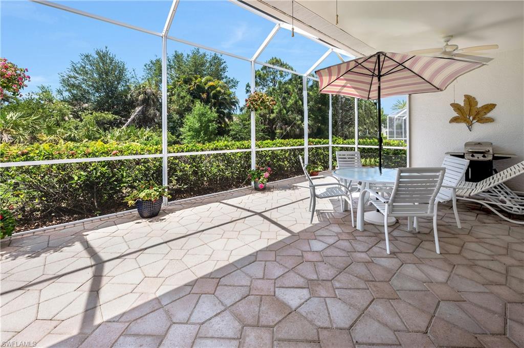 917 Fairhaven Court, Unit 29 Naples, FL 34104 - Photo 24 of 40 a view of a chairs and table in a patio
