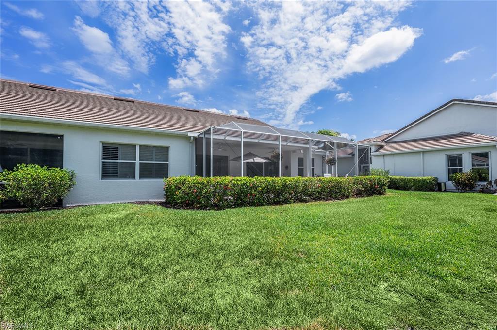 917 Fairhaven Court, Unit 29 Naples, FL 34104 - Photo 27 of 40 a view of outdoor space yard and front view of a house
