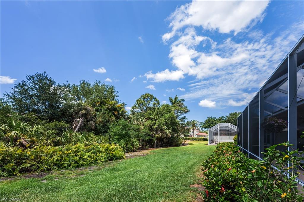 917 Fairhaven Court, Unit 29 Naples, FL 34104 - Photo 28 of 40 a backyard of a house with lots of green space