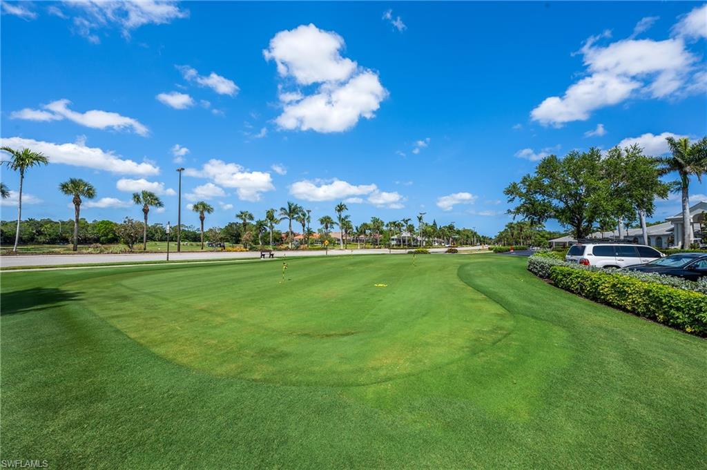 917 Fairhaven Court, Unit 29 Naples, FL 34104 - Photo 30 of 40 a view of a building and yard with green space