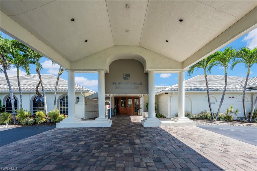 917 Fairhaven Court, Unit 29 Naples, FL 34104 - Photo 32 of 40 a view of a building with garden