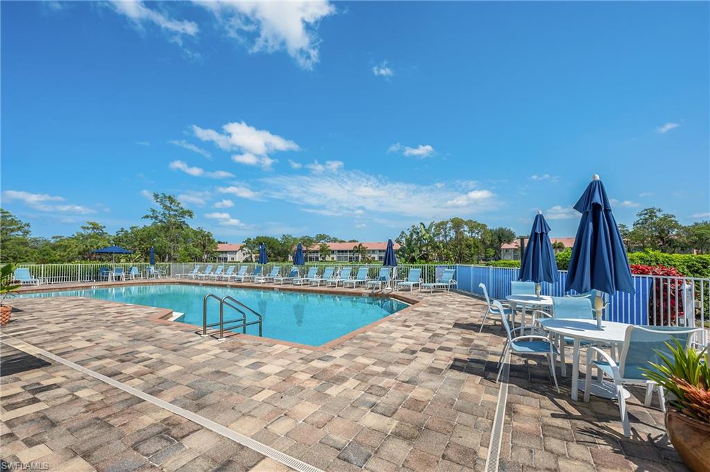 917 Fairhaven Court, Unit 29 Naples, FL 34104 - Photo 33 of 40 a view of swimming pool with outdoor seating and plants