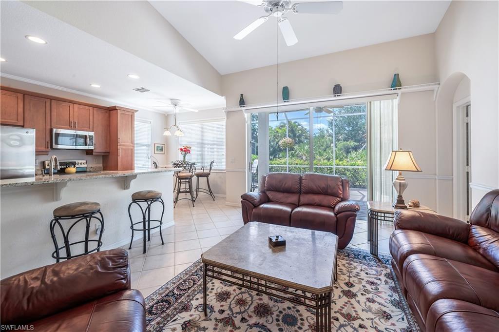 917 Fairhaven Court, Unit 29 Naples, FL 34104 - Photo 6 of 40 a living room with furniture and a large window