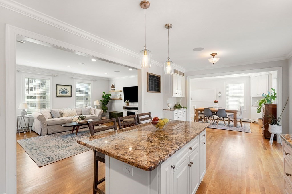 5 Abbot Court Marblehead, MA 01945 - Photo 8 of 27 a living room with furniture kitchen view and a wooden floor