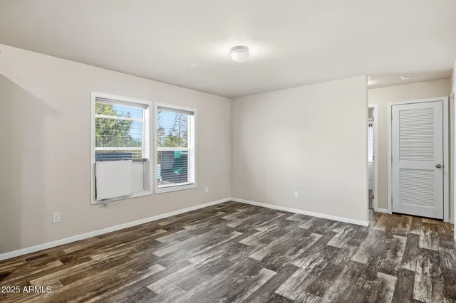 a living room with furniture a ceiling fan and a rug