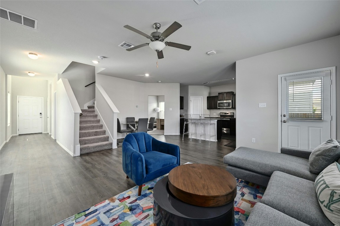 100 Comet Drive, Unit 1I Jarrell, TX 76537 - Photo 14 of 25 a living room with furniture and a wooden floor