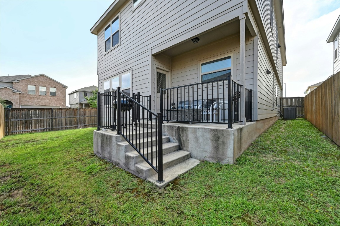 100 Comet Drive, Unit 1I Jarrell, TX 76537 - Photo 16 of 25 a view of a house with a yard and deck