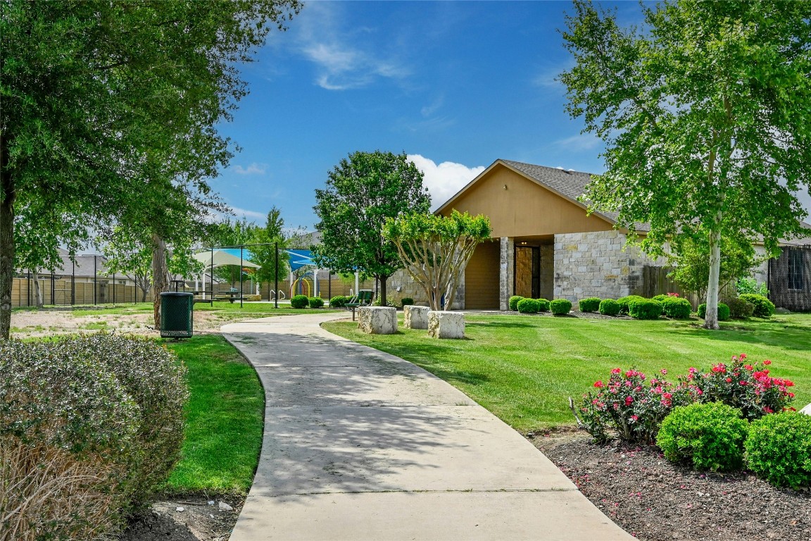 100 Comet Drive, Unit 1I Jarrell, TX 76537 - Photo 23 of 25 a front view of a house with a yard
