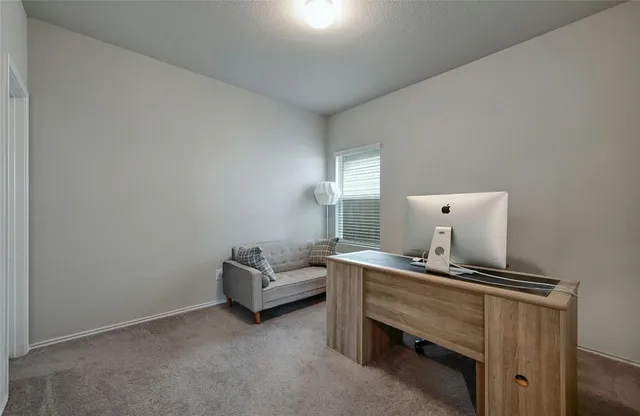 a room with a table and chairs