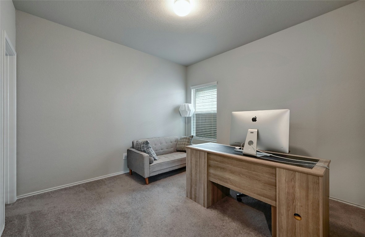 100 Comet Drive, Unit 1I Jarrell, TX 76537 - Photo 8 of 25 a room with a table and chairs