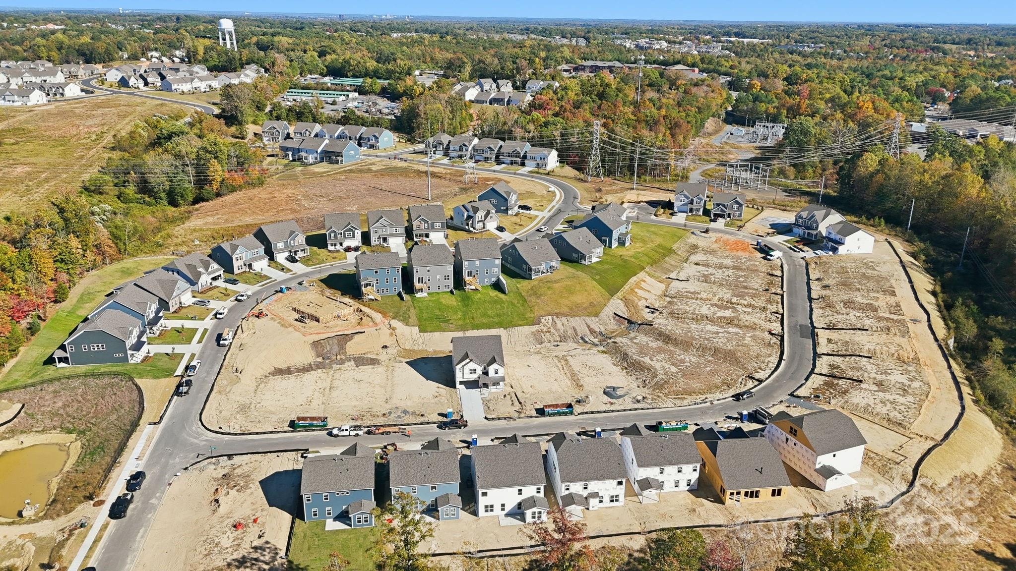 1590 Hubert Graham Way Tega Cay, SC 29708 - Photo 29 of 32 an aerial view of residential houses with outdoor space