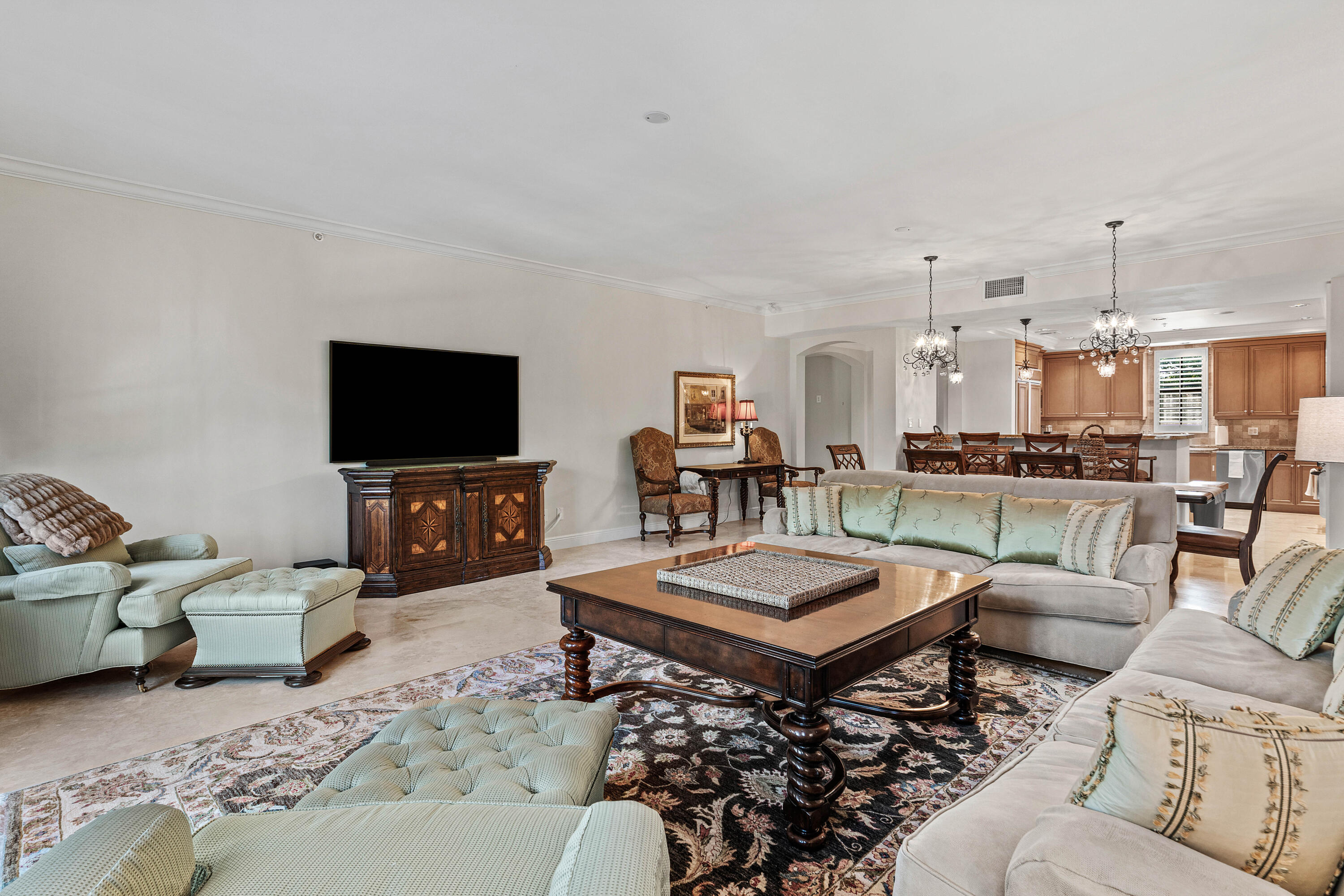 110 Gleason Street, Unit 203 Delray Beach, FL 33483 - Photo 8 of 25 a living room with furniture and a flat screen tv