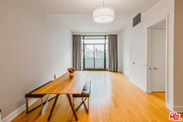 a bed room with a bed and a chandelier