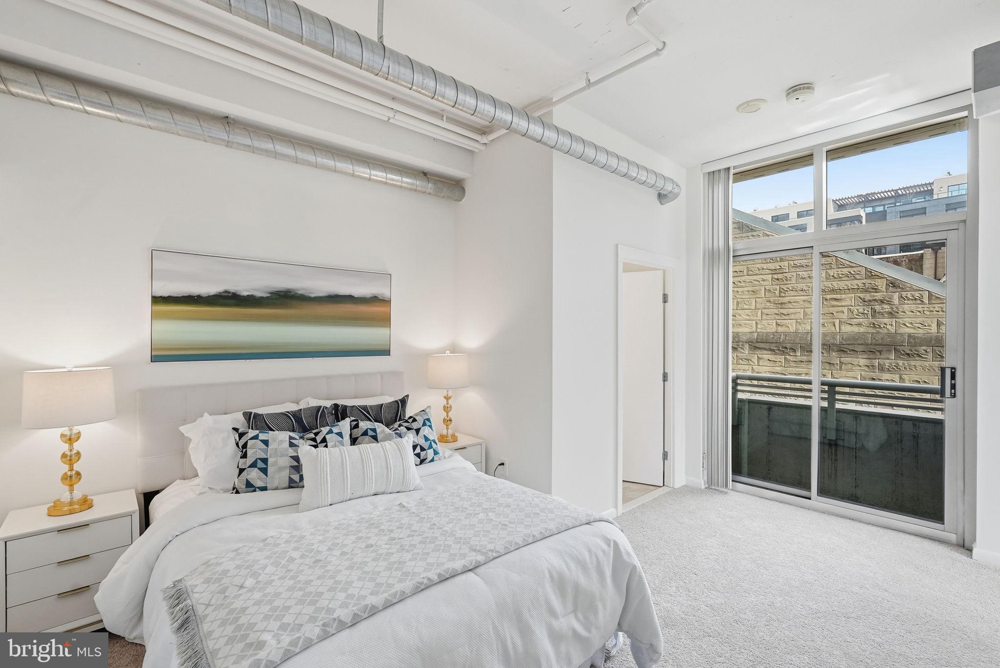 811 4th Street Northwest, Unit 404 Washington, DC 20001 - Photo 9 of 22 Bed 1 w/ Ensuite Bath & Sliding Door to Balcony