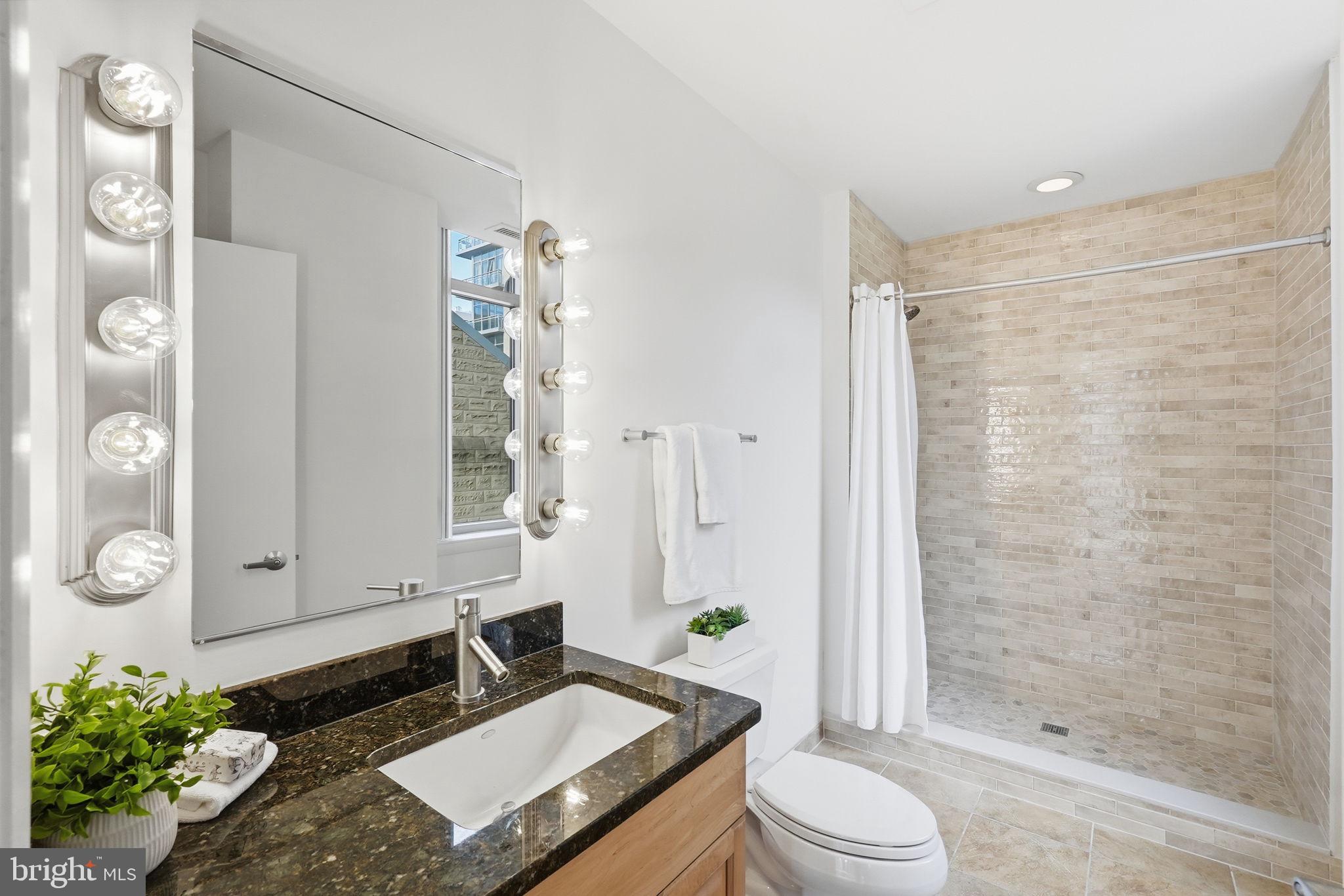 811 4th Street Northwest, Unit 404 Washington, DC 20001 - Photo 10 of 22 Ensuite Bathroom w/ Newly Renovated Shower