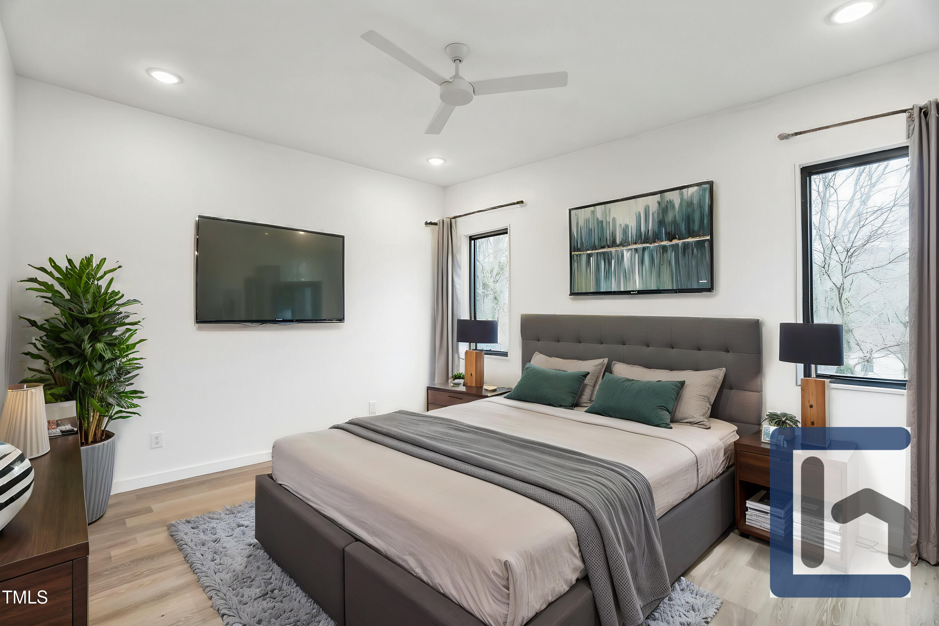 715 1/2 Van Buren Road Raleigh, NC 27604 - Photo 17 of 23 a bedroom with a bed and a flat screen tv