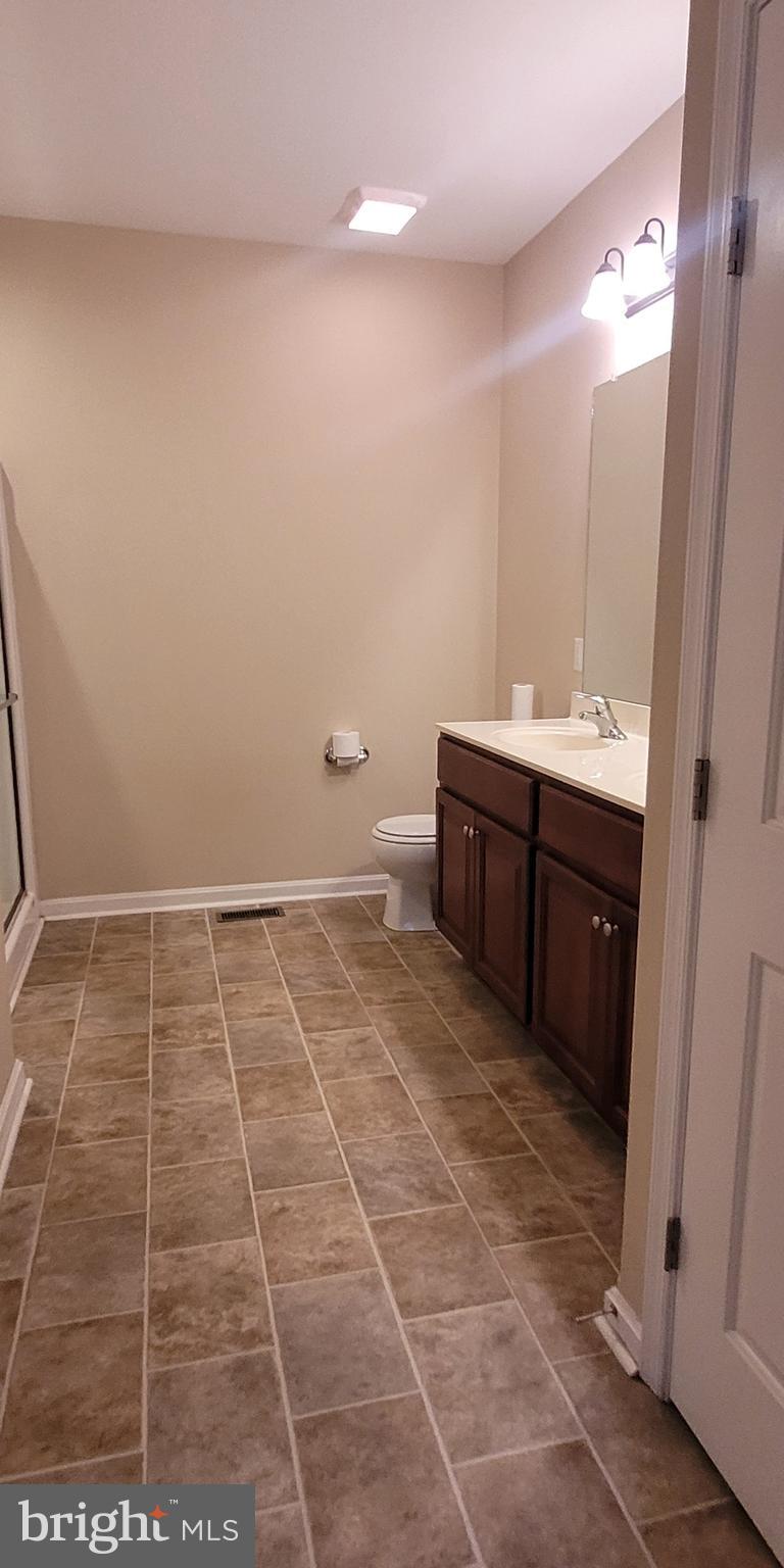68 Split Oak Drive Felton, DE 19943 - Photo 11 of 22 a bathroom with a sink and a mirror