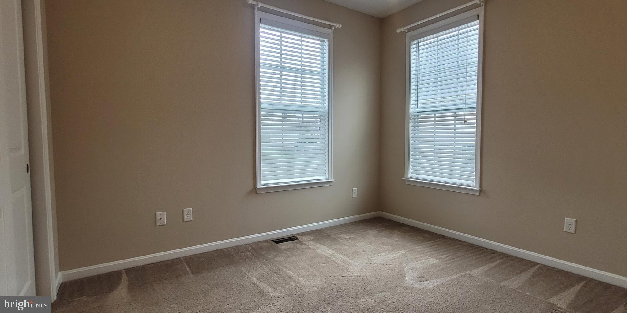 68 Split Oak Drive Felton, DE 19943 - Photo 17 of 22 an empty room with windows