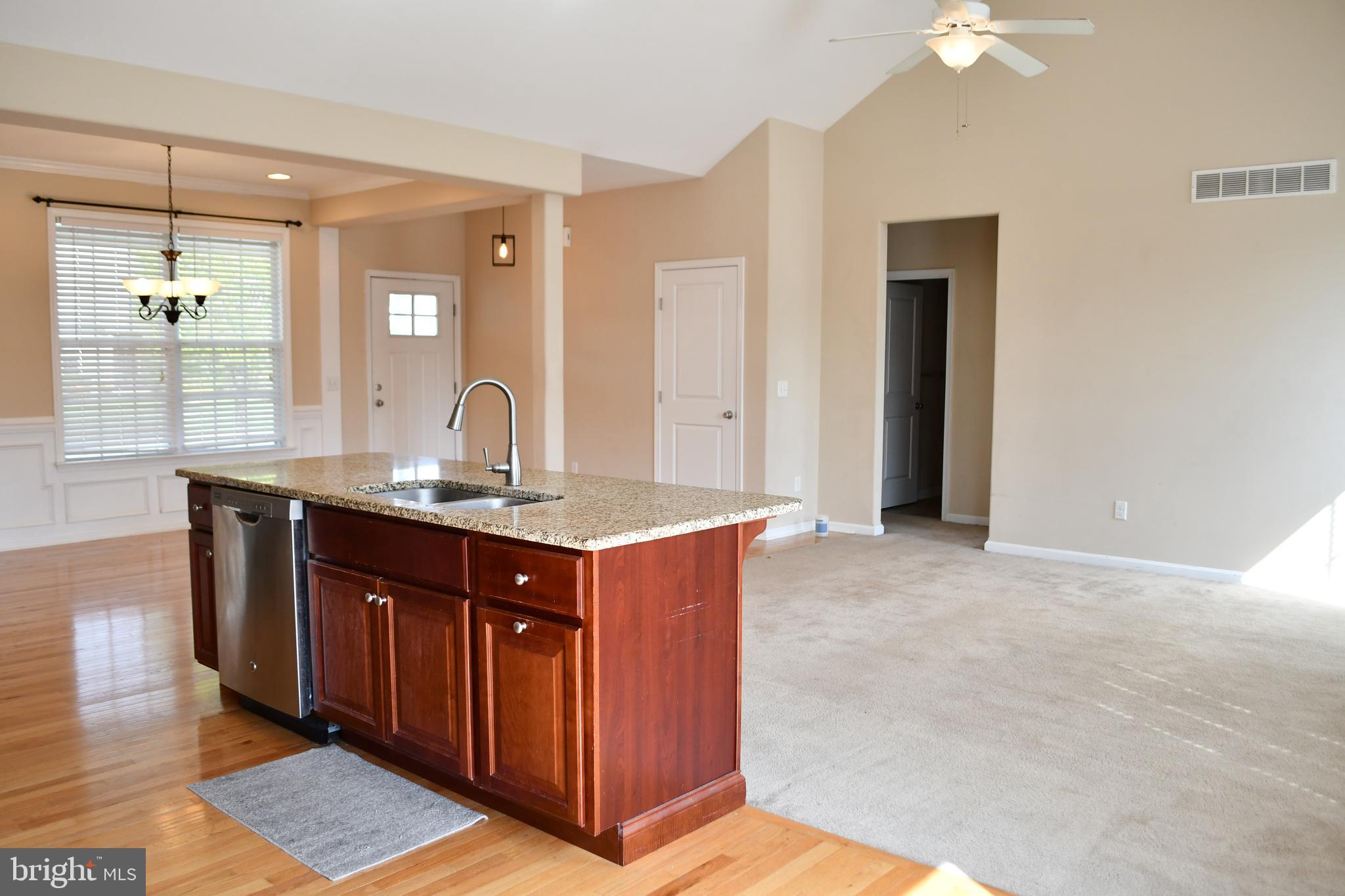 68 Split Oak Drive Felton, DE 19943 - Photo 4 of 22 a bathroom with a granite countertop sink and a mirror