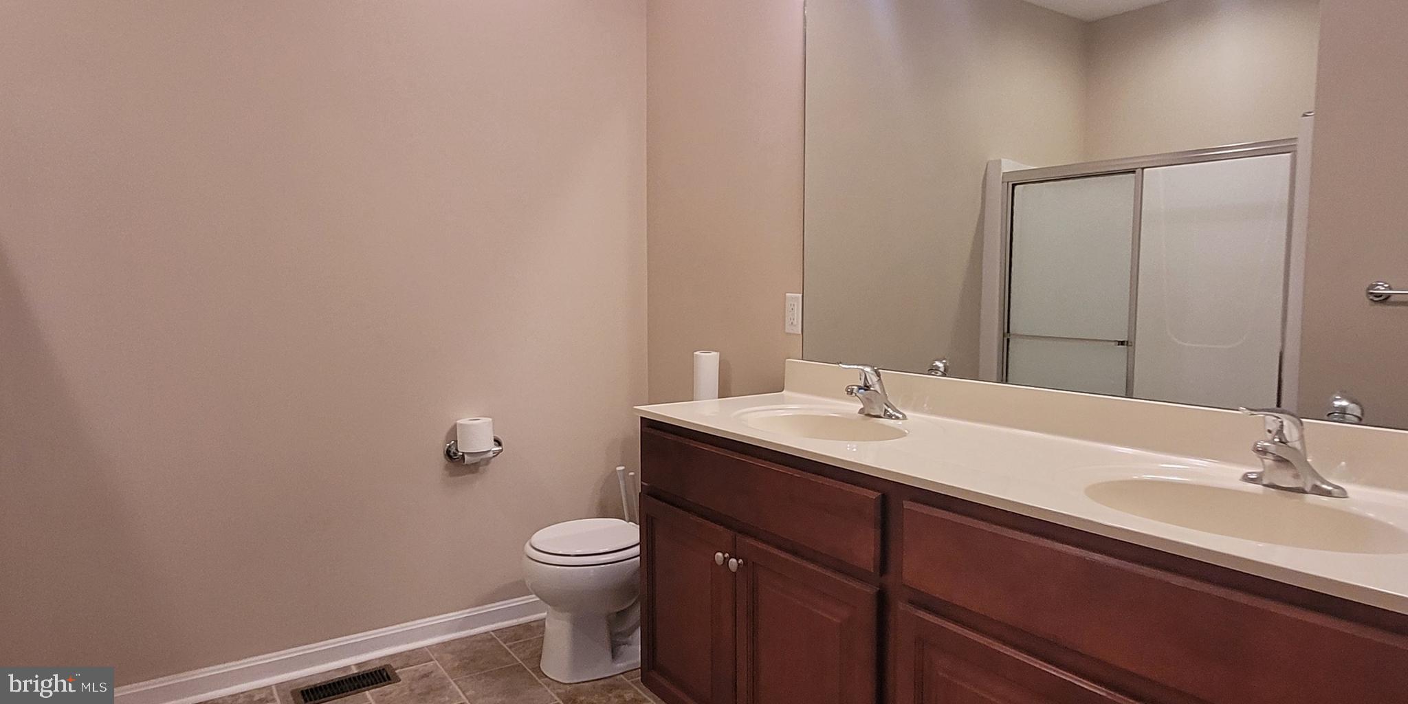 68 Split Oak Drive Felton, DE 19943 - Photo 10 of 22 a bathroom with a sink and a toilet
