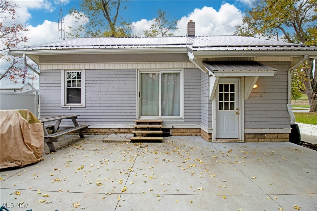 5699 Massillon Road Dalton, OH 44618 - Photo 15 of 24 Rear view of house with a patio area