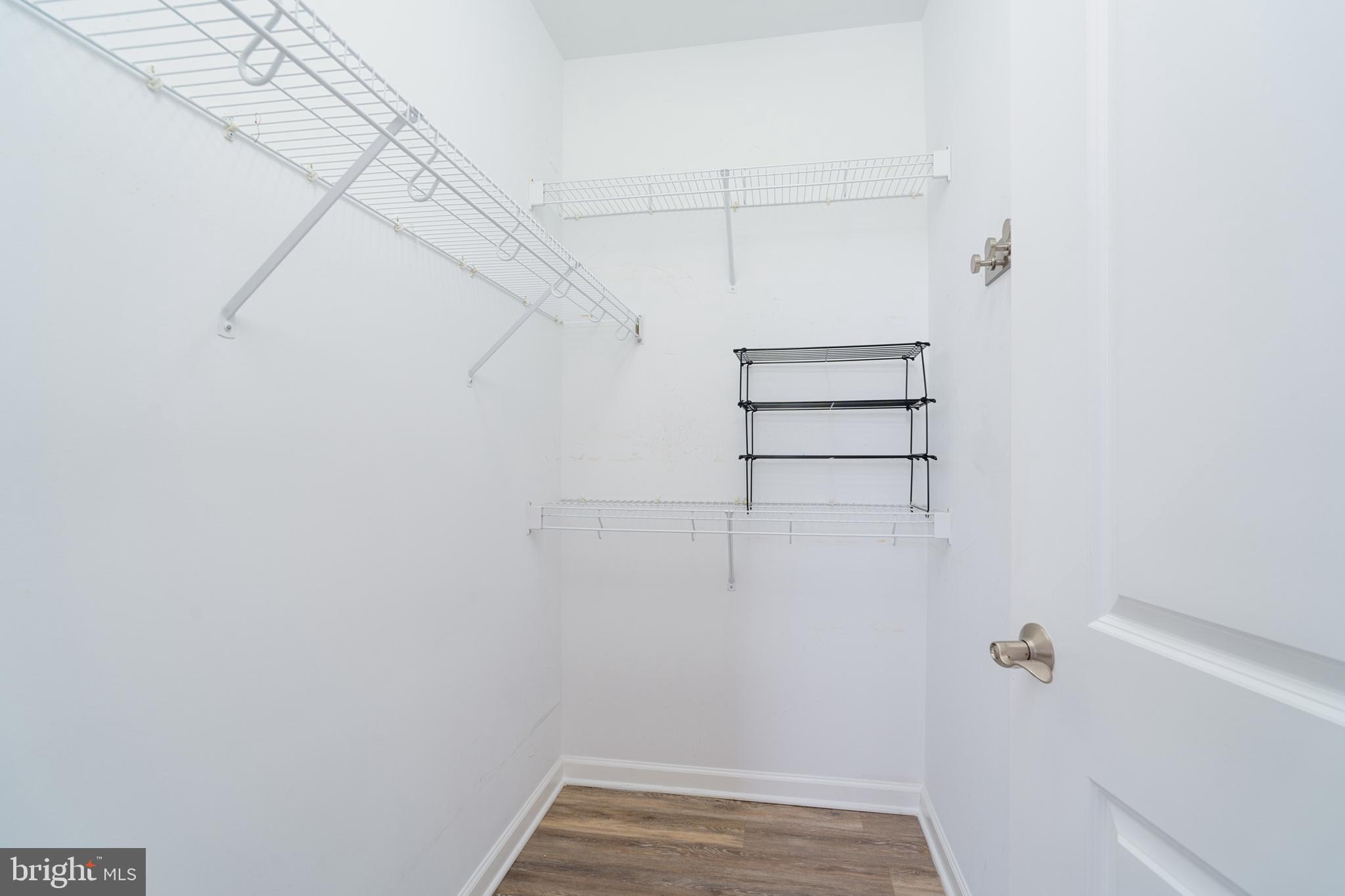 444 West Broad Street, Unit 401 Falls Church, VA 22046 - Photo 13 of 43 a view of a room with racks on the wall