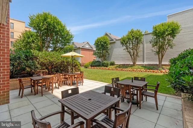 a view of a chairs and table in patio