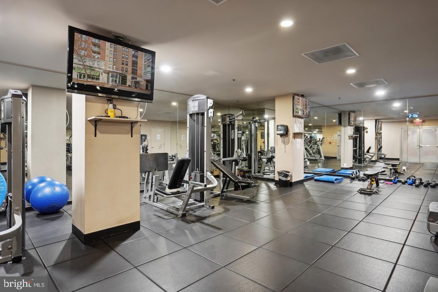 444 West Broad Street, Unit 401 Falls Church, VA 22046 - Photo 35 of 43 a view of a room with gym equipment