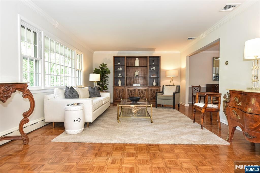 60 Dimmig Road Upper Saddle River, NJ 07458 - Photo 11 of 40 a living room with furniture a table and large window