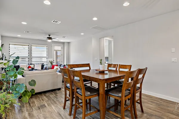 a kitchen with a table and chairs in it