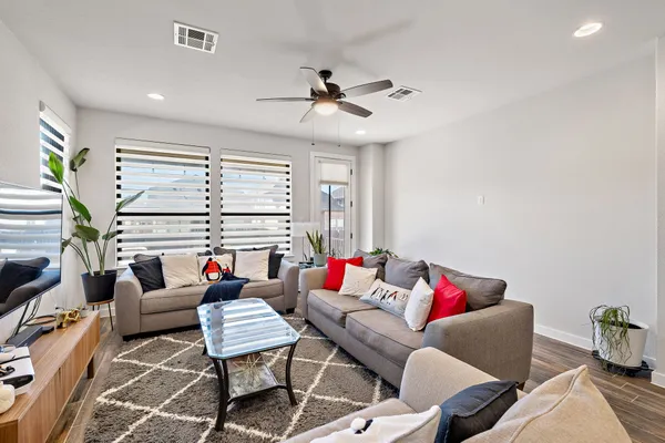 a living room with furniture and a large window