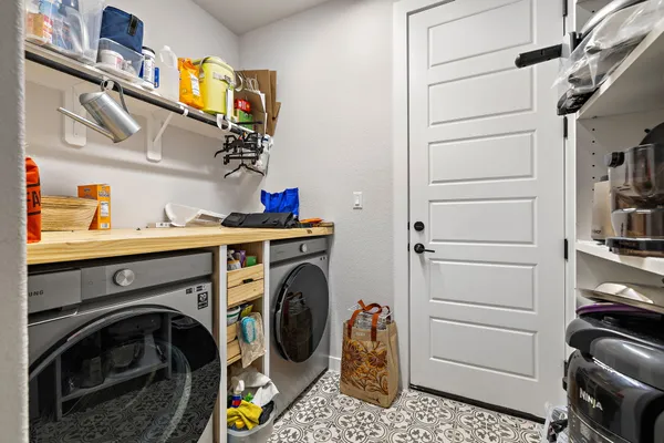 a utility room with dryer and washer