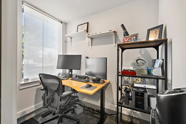 a workspace with furniture and lamp