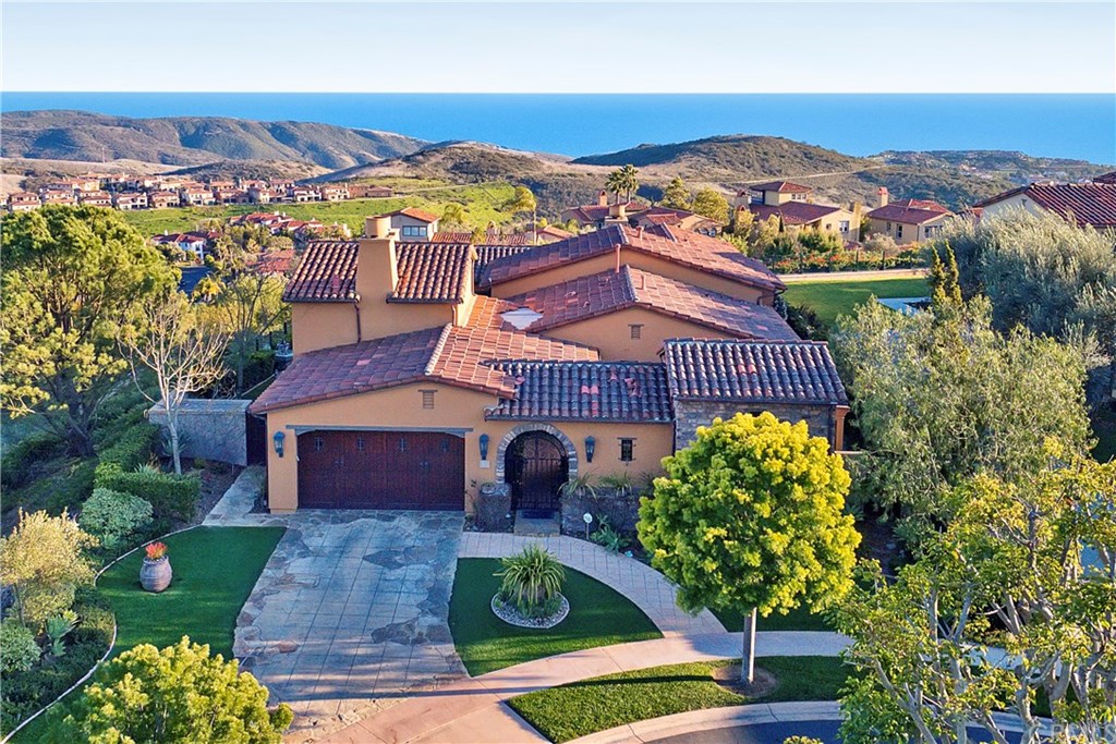 Enjoy coastal breezes from this Tuscan beauty which sits at the end of a quiet cul de sac overlooking The Pacific.