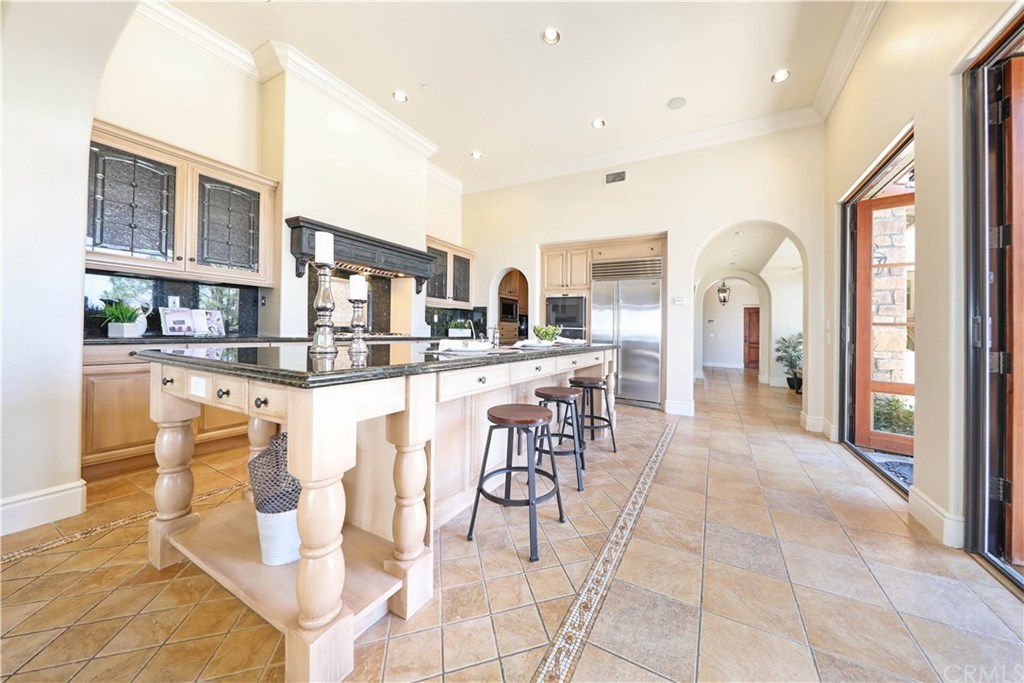 53 Overlook Drive Newport Coast, CA 92657 - Photo 13 of 28 Stunning kitchen boast recessed lighting, crown molding, Travertine Tile flooring and lots of space.