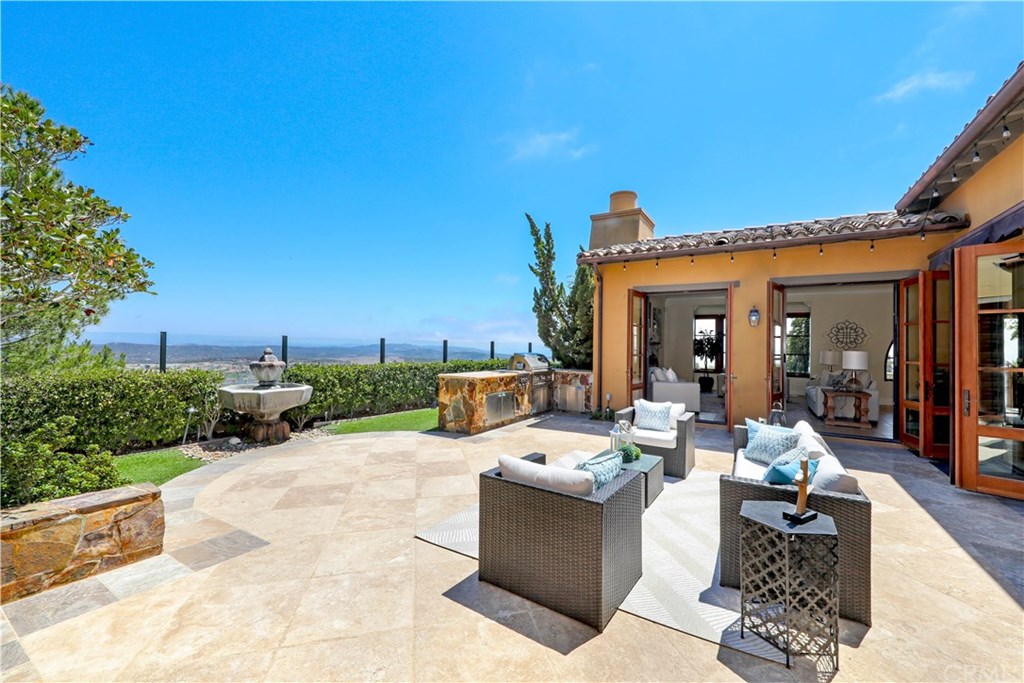 53 Overlook Drive Newport Coast, CA 92657 - Photo 23 of 28 Fountains, Synthetic Grass, palms, lighting perfectly and a built in BBQ perfectly complete this amazing view yard.