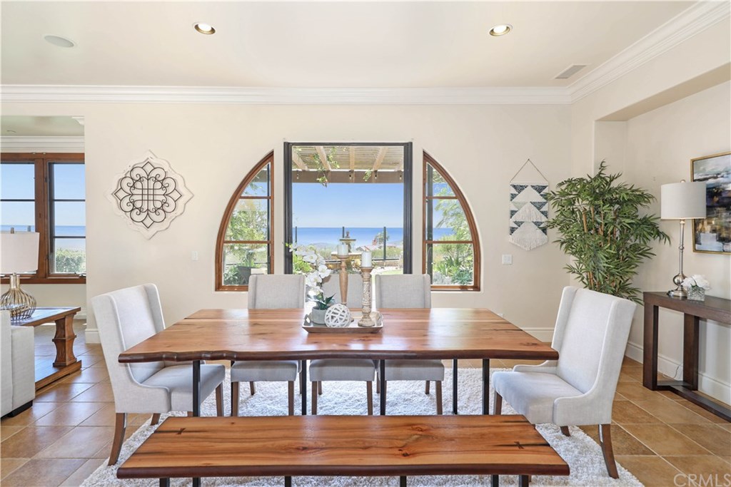 53 Overlook Drive Newport Coast, CA 92657 - Photo 10 of 28 French doors off the dining room open out to the covered patio where you can enjoy endless ocean views.