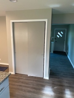15500 Wolf Road Orland Park, IL 60467 - Photo 18 of 24 a view of an empty room with wooden floor and a window