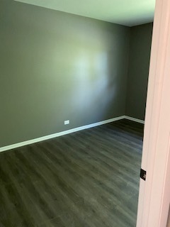 15500 Wolf Road Orland Park, IL 60467 - Photo 5 of 24 an empty room with wooden floor