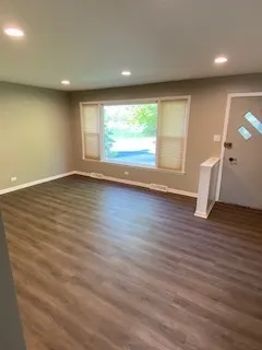 a view of a hallway with windows