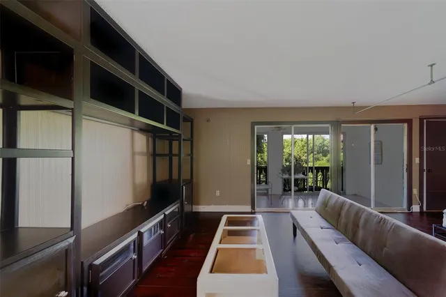 a bedroom with furniture and a wooden floor