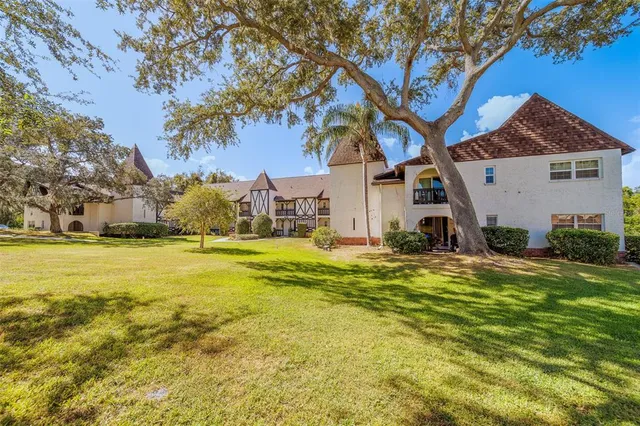a house view with swimming pool in front of it