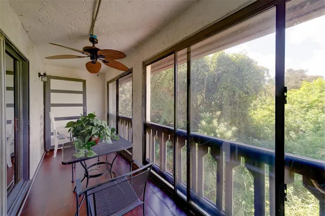 a view of a porch with wooden floor