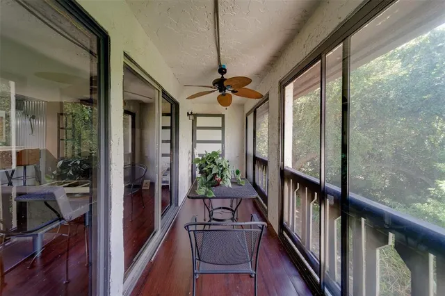 a view of a porch with furniture and a window