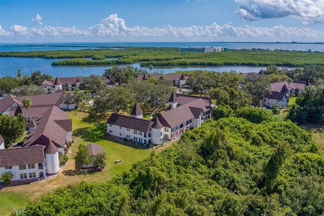 a view of a house with a yard and a garden