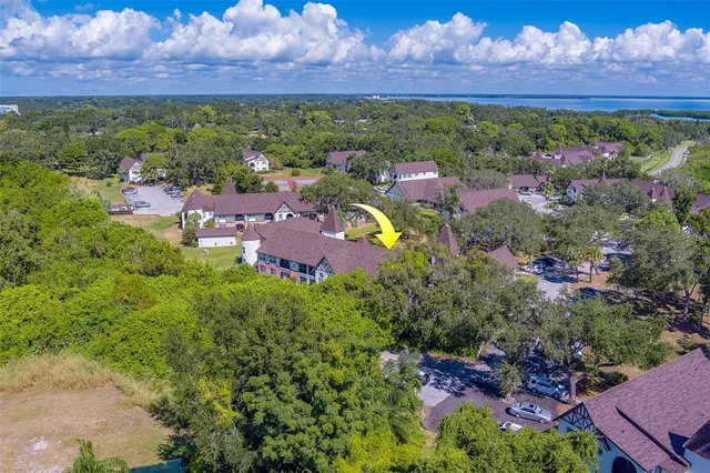 an aerial view of a houses with yard