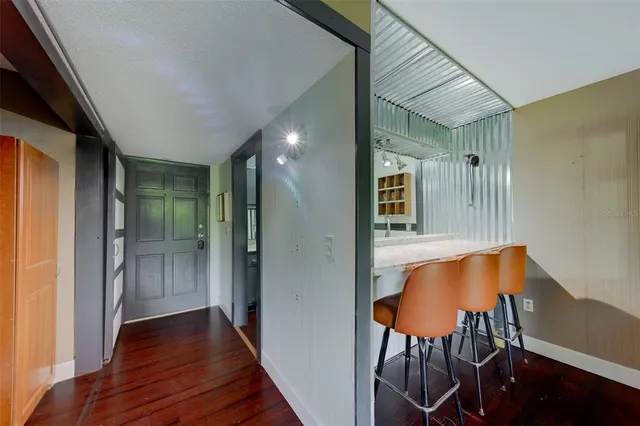 an outdoor dining space with furniture and outdoor view