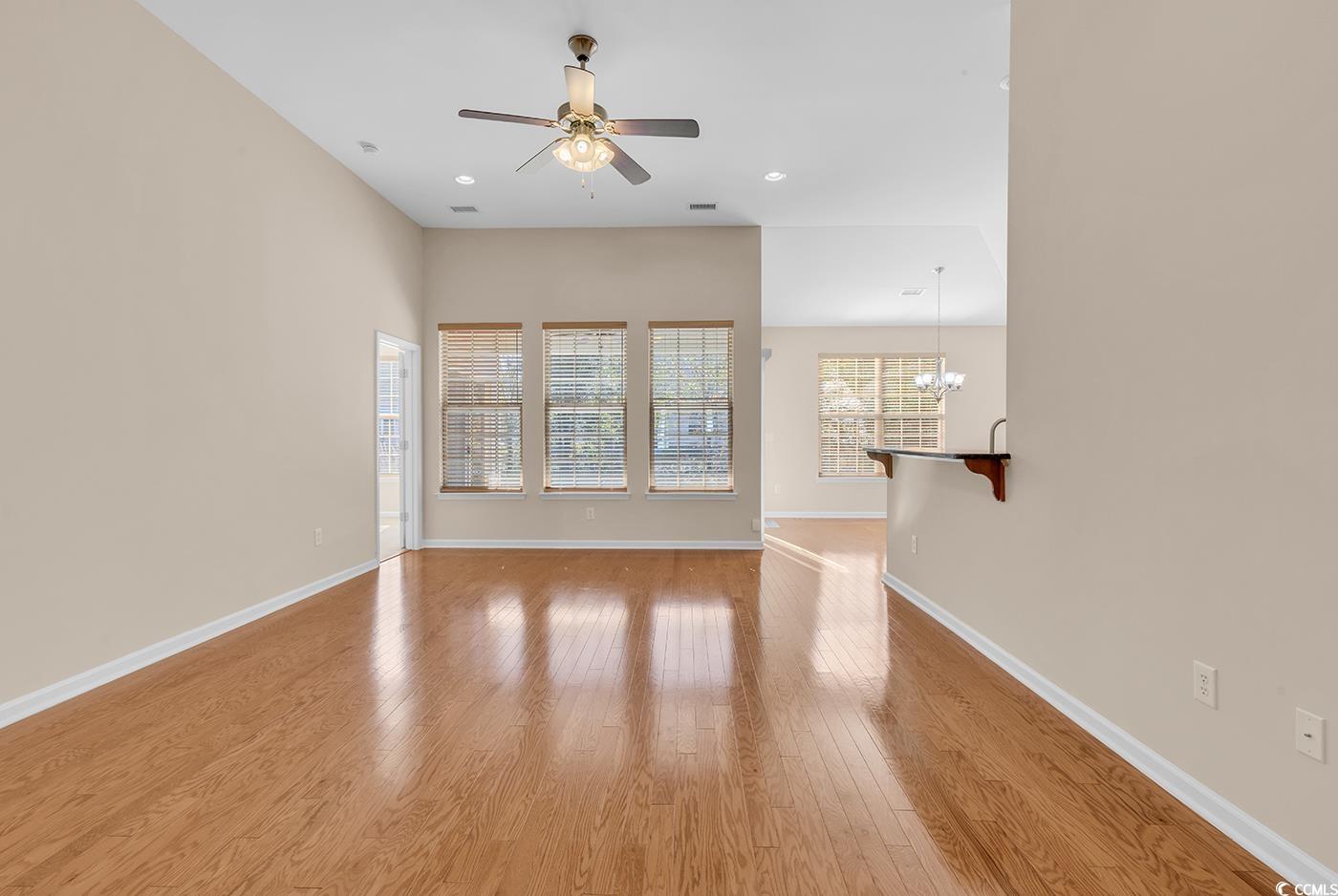 1612 Fairforest Court Conway, SC 29526 - Photo 6 of 40 Unfurnished room featuring light wood-style flooring, a chandelier, a ceiling fan, and recessed lighting