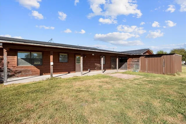a house view with a backyard space